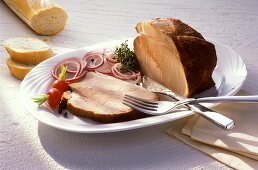 Roast pork with onions, radishes and baguette