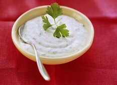 Herb mayonnaise in bowl with spoon