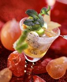 Champagne sangria with fruit and mint; candied fruit