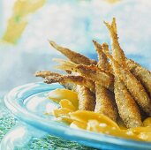 Fish (smelt) in nut crust on fruit