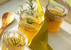 Apple and rosemary jelly in jam jars