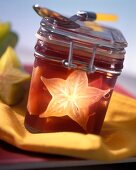 Red wine jelly with carambola in jam jar