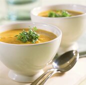 Peanut soup with carrots and fresh cress