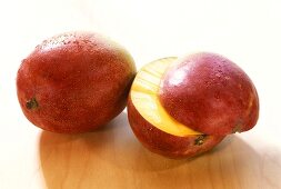 Mangos (Tommy Atkins variety), one with a piece cut off