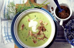Pea soup with matje herrings, pumpernickel crumbs & sour cream