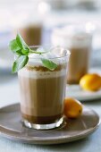 Hot orange- and mint cocoa in glasses