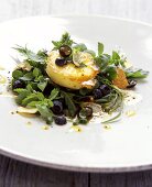 Herb salad with blueberries and fried goat's cheese