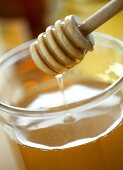 Honey in jar with honeycomb