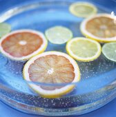 Slices of citrus fruits in mineral water