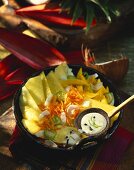 Spicy pineapple and mango salad with coconut