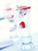 Glass of mineral water with strawberry