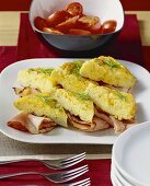 Chive omelettes with ham; tomato salad