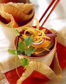 Soya noodles with onions in a bowl