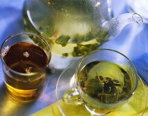 Herb tea in cups and in the pot