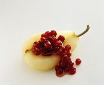 Pear half stuffed with cranberries