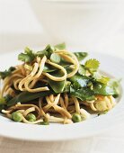 Linguine with mangetout, peas and coriander leaves