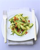 Courgette salad with diced tomatoes and coriander seeds