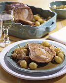 Roast pork with grapes and pearl onions