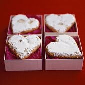 Heart-shaped biscuits with icing sugar to give as gifts
