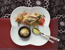 Branzino on vegetables with lemon salt & frozen olive oil