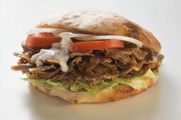 Döner sandwich with onions, tomatoes and yoghurt sauce