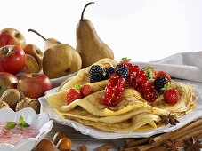 Pancakes, fresh fruit, spices and nuts