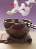 Asian place-setting (napkin, bowl and chopsticks)