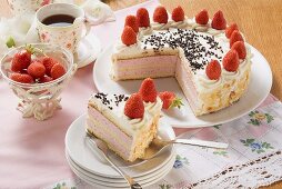 Strawberry cream cake with flaked almonds to serve with coffee