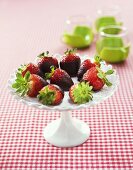 Chocolate-dipped strawberries on cake stand