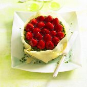 Strawberry tart with white chocolate and pistachios