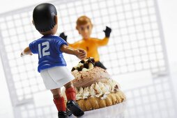 Football cake with footballer and goalkeeper