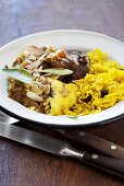 Bobotie (minced meat dish with a custard topping, South Africa) with chutney and saffron rice