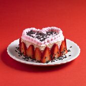 Heart-shaped sponge cake with strawberry cream