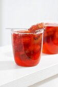 Redcurrant jelly with mixed fruit in two glasses