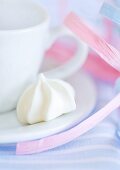 Cup and saucer with meringue