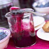 Blueberry jam in jar with spoon