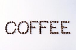 The word COFFEE written in coffee beans