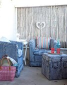 Armchairs and stool covered in jeans fabric