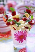 Cheese and strawberries on cocktail sticks with fresh mint