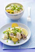 Potato salad with herring and chives