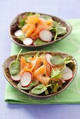 Spinach and radish salad with smoked salmon and peppercorns