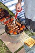 Barbecuing food on barbecue bucket