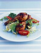 Glazed chicken legs with salad