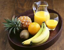 Still life with tropical fruit and fruit juice