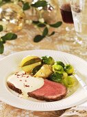 Roast beef with potatoes, Brussels sprouts and sauce (Christmas)