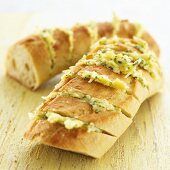 Garlic baguette with cheese and herbs