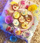 Cupcakes with amusing faces for children