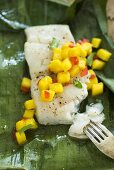 Fish steamed in banana leaf with mango salsa