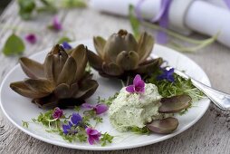 Baby artichokes with herb cream and violets