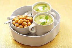 Cream of pea soup with mint and soup pearls